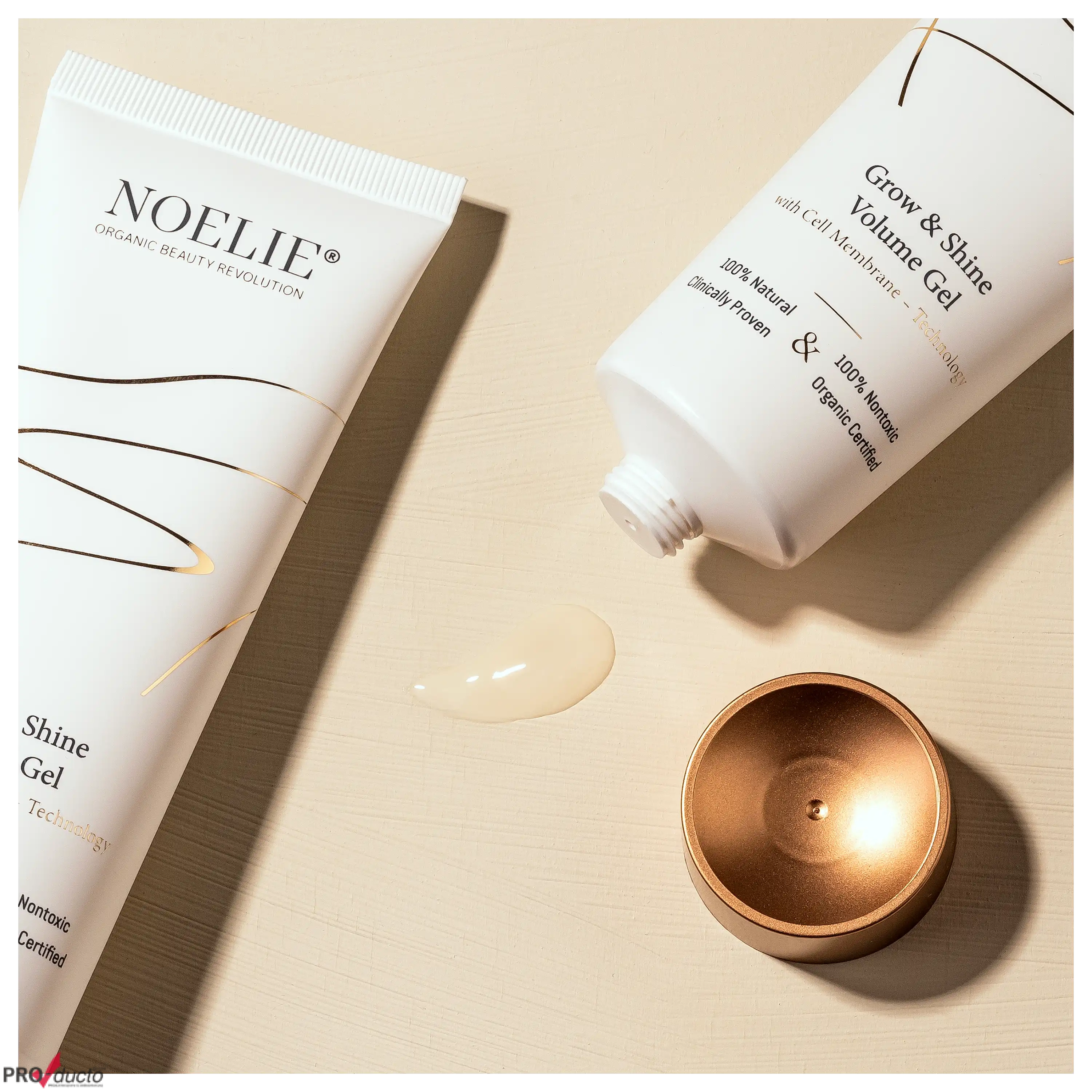 Professionelle Produktfotos von NOELIE Grow & Shine Volume Gel Tuben mit Textur auf beigem Hintergrund.