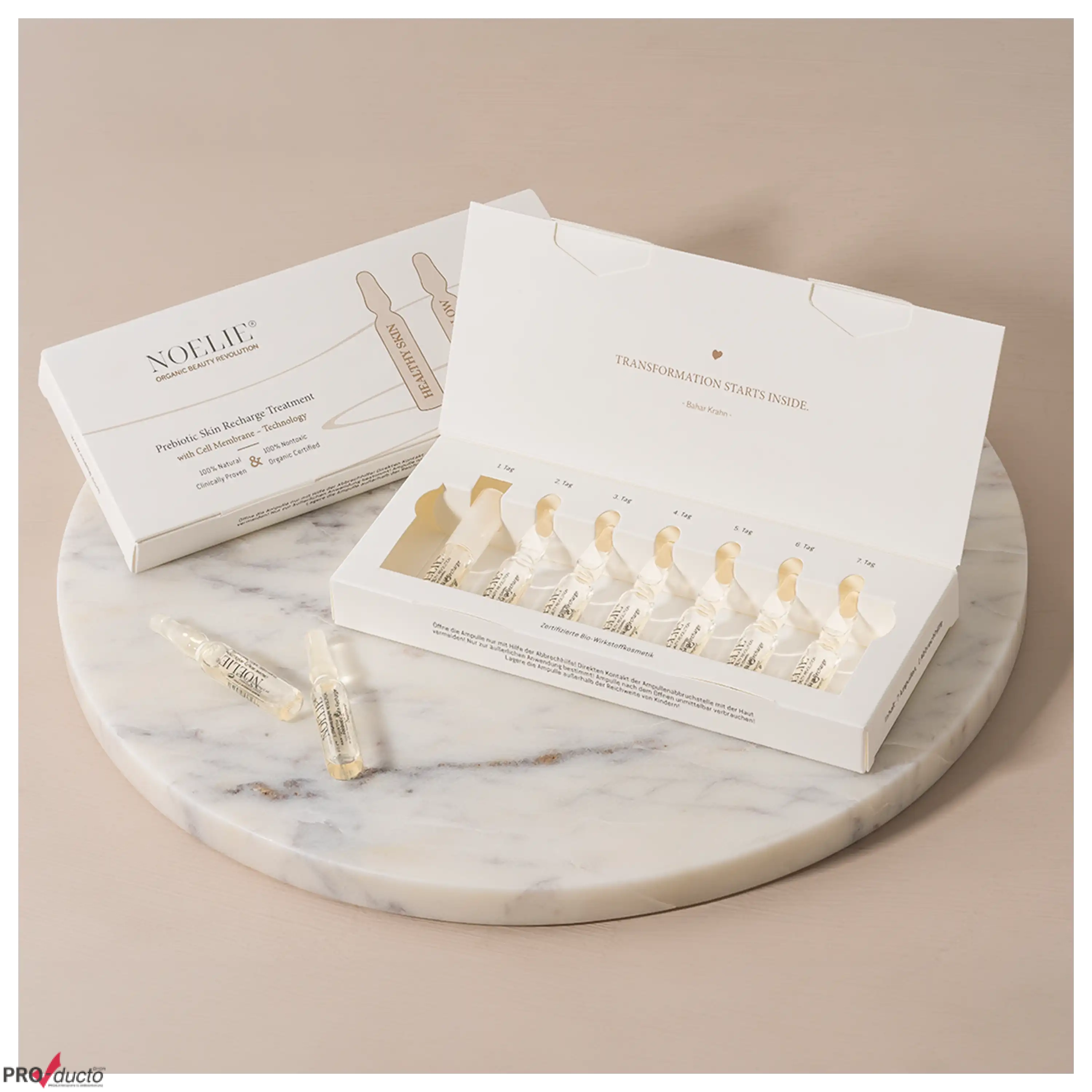 NOELIE Ampullen-Set für eine 7-Tage-Kur auf einer Marmorplatte, professionelle Produktfotos von PRO-ducto GmbH.