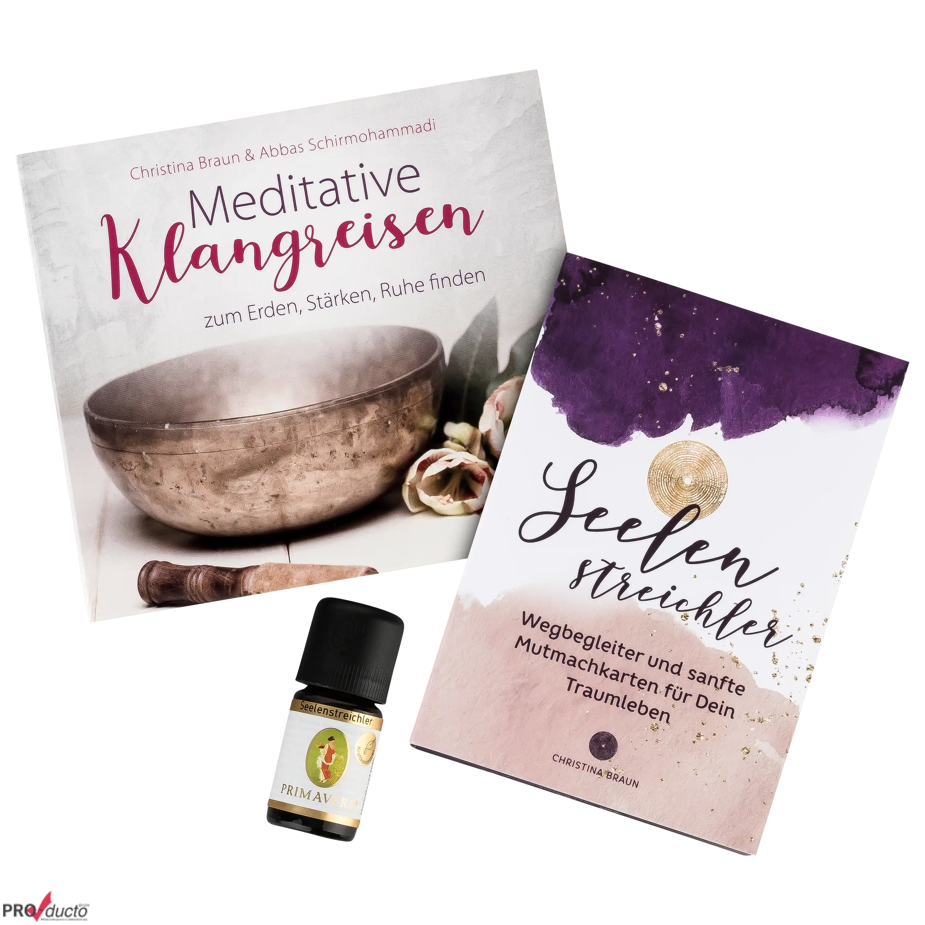 Zwei Bücher mit dem Titel Meditative Klangreisen und Seelenstreichler sowie ein ätherisches Öl im Fotostudio.
