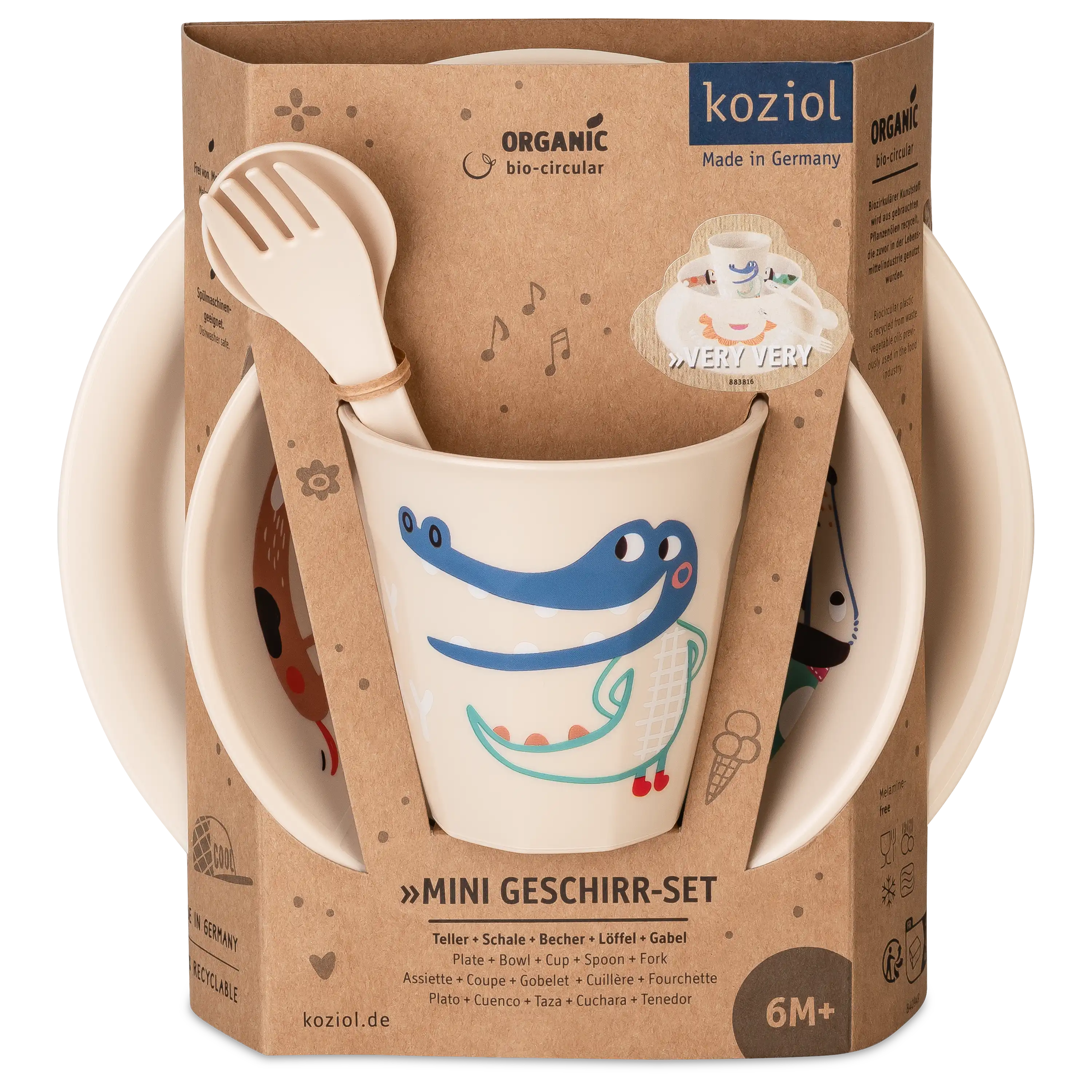 Koziol Mini Geschirr-Set für Kinder in nachhaltiger Verpackung mit Becher, Löffel, Gabel, Teller und Schale.