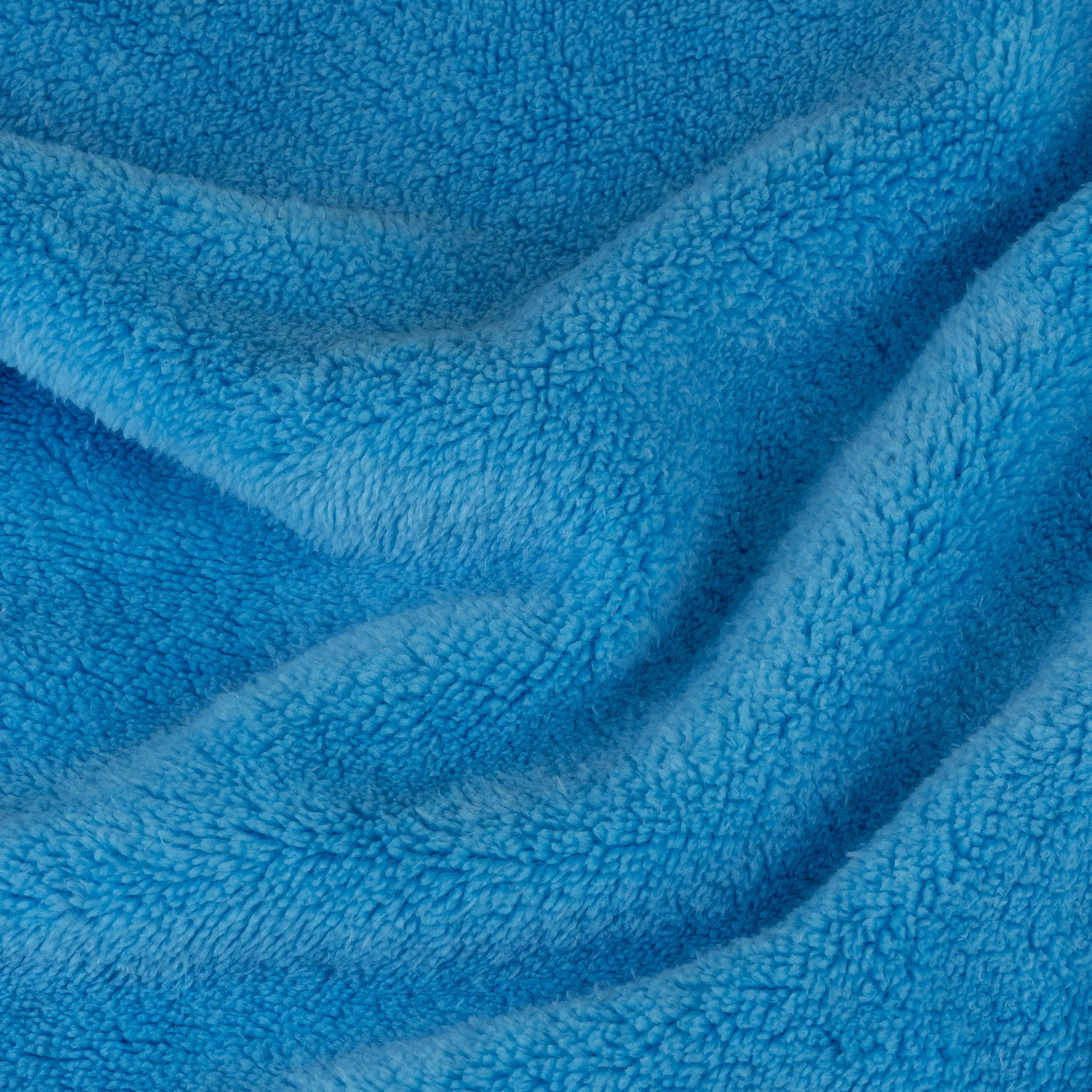 Nahaufnahme von blauem Frottee-Stoff für professionelle Produktfotografie von PRO-ducto GmbH für Textilfotografie.